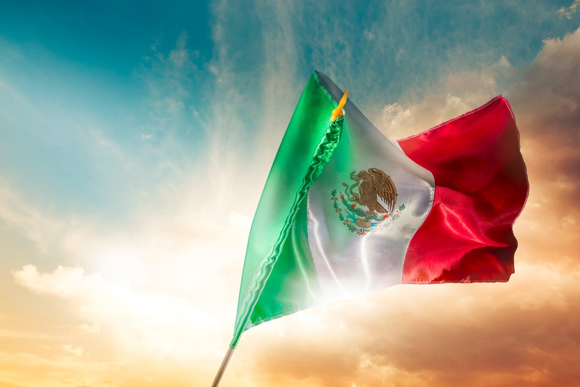 Mexican flag against a bright sky, independence day